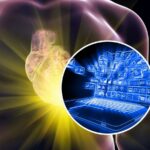 sfondo corpo umano con cuore illuminato e tondo con computer digitalizzato