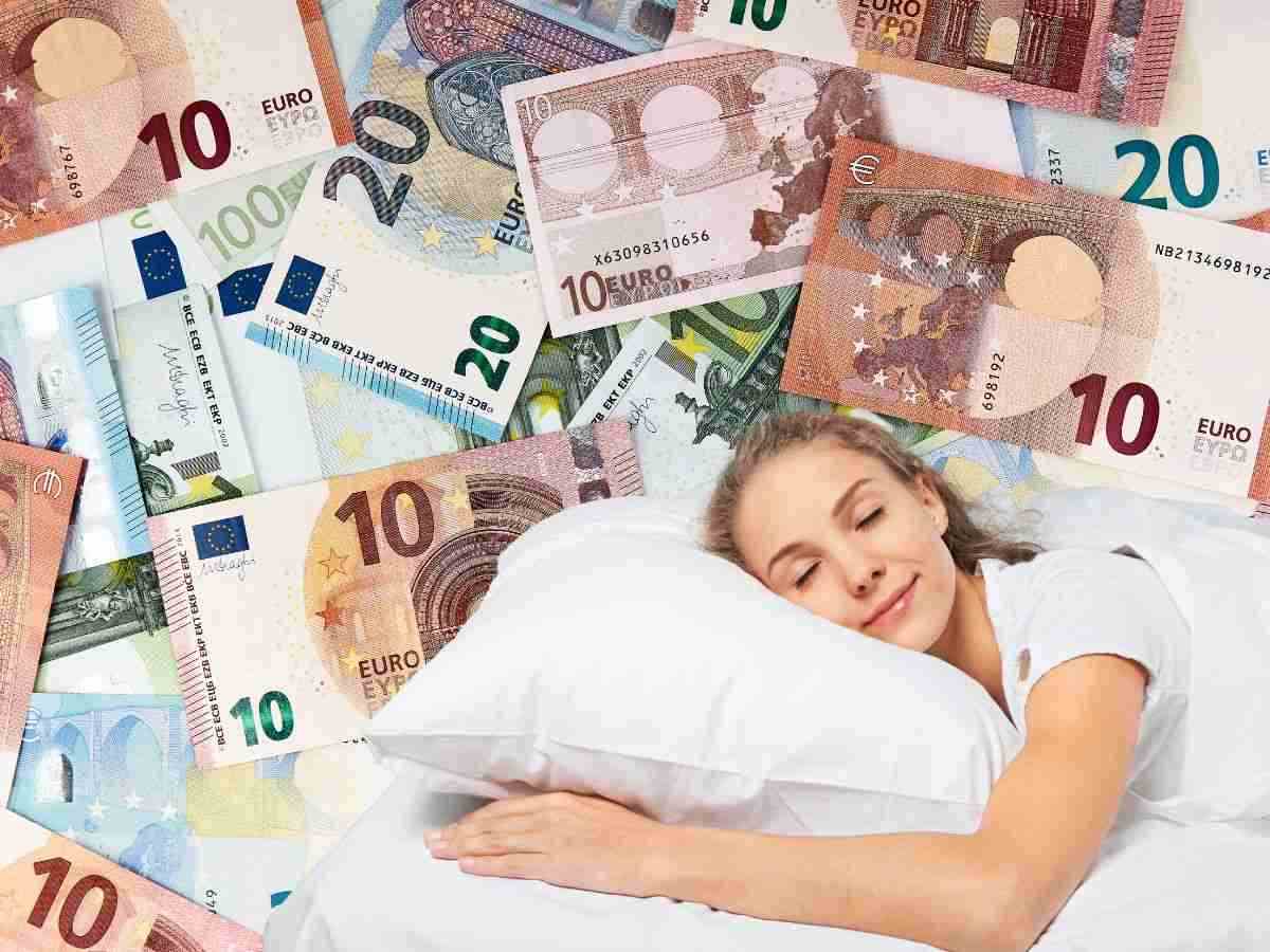 sfondo banconote euro e donna che dorme